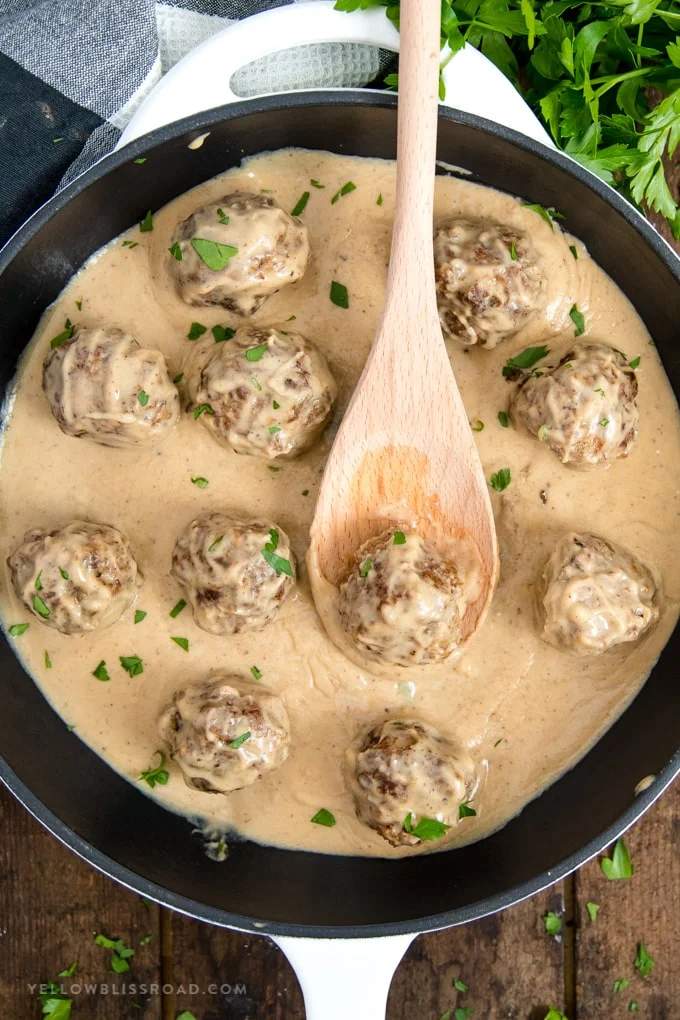 Swedish meatballs drenched in a rich, tangy sour cream gravy over buttered egg noodles
