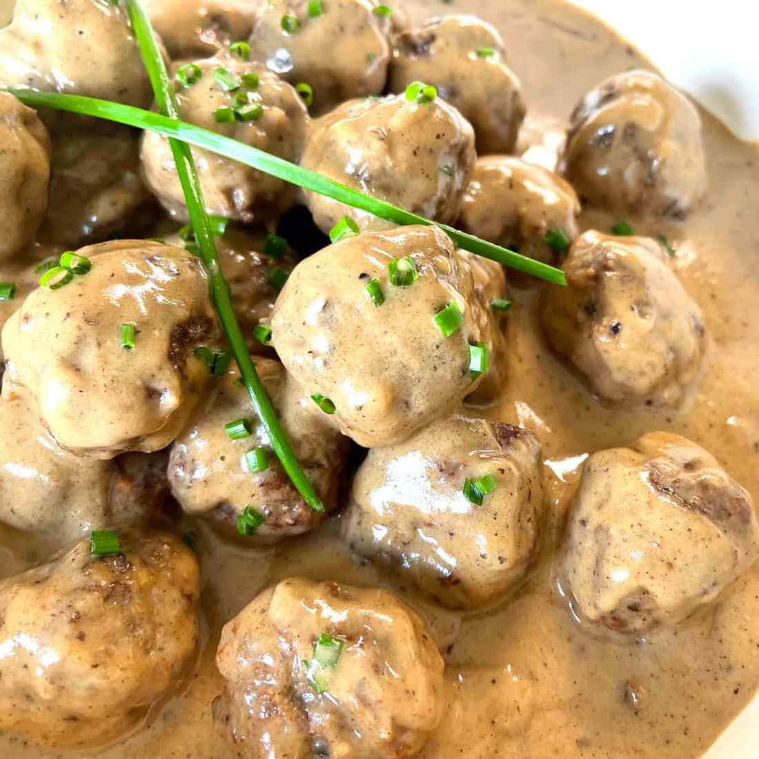 Swedish meatballs infused with crispy diced bacon and smoked paprika in savory cream gravy