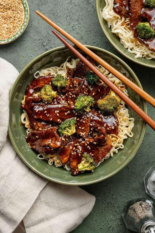 Overhead beef and broccoli noodle bowl with tender beef, crisp broccoli, and glossy noodles