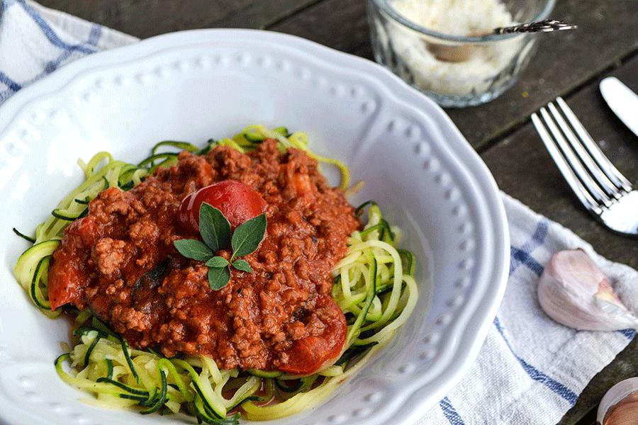 Zucchini noodle bolognese with beef, parmesan, fresh basil, rich tomato sauce, pasta