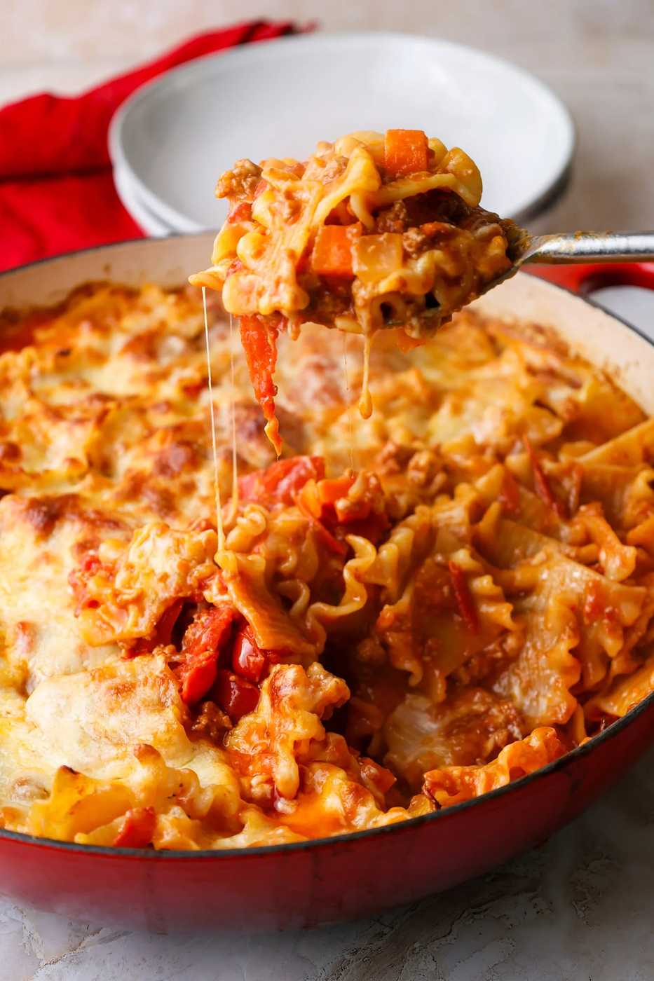 Bolognese pasta bake with beef, parmesan, fresh basil, rich tomato sauce, pasta