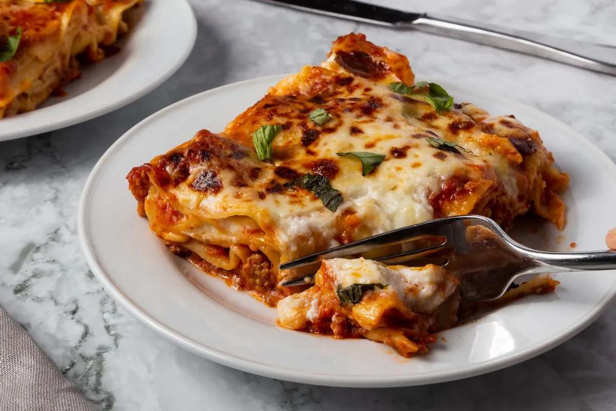 Bolognese lasagna layers beef bolognese, parmesan, fresh basil, rich tomato sauce, pasta sheets for dinner