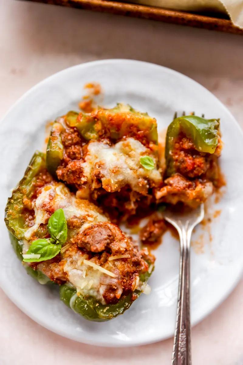 Colorful bell peppers filled with rich beef bolognese, topped with melted parmesan and fresh basil