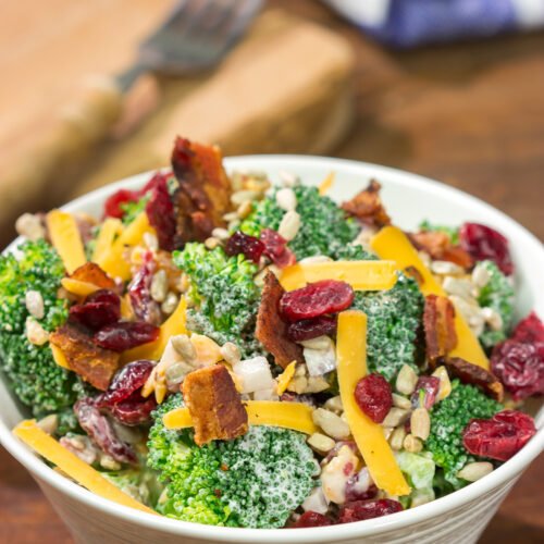 Classic broccoli salad with crisp florets, tangy mayo dressing, walnuts, dried apricots, crumbled feta