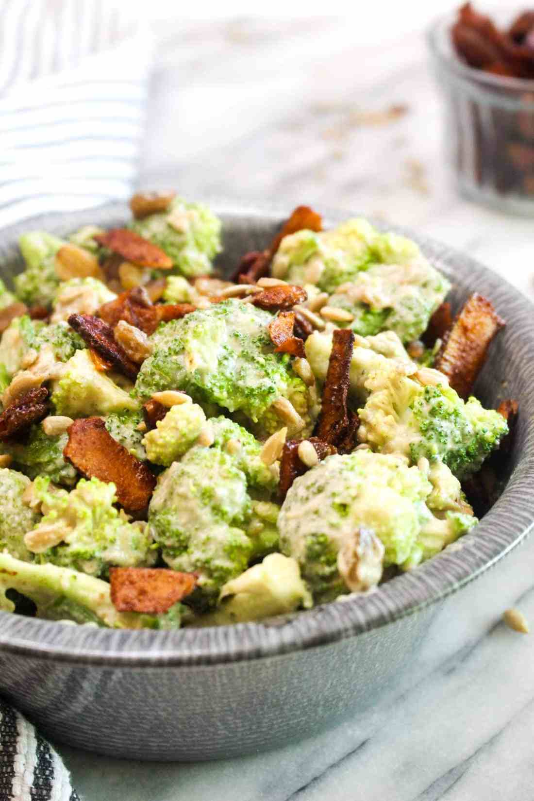 Classic broccoli salad with crisp florets, creamy bacon dressing, sunflower seeds, raisins, and shredded cheddar cheese