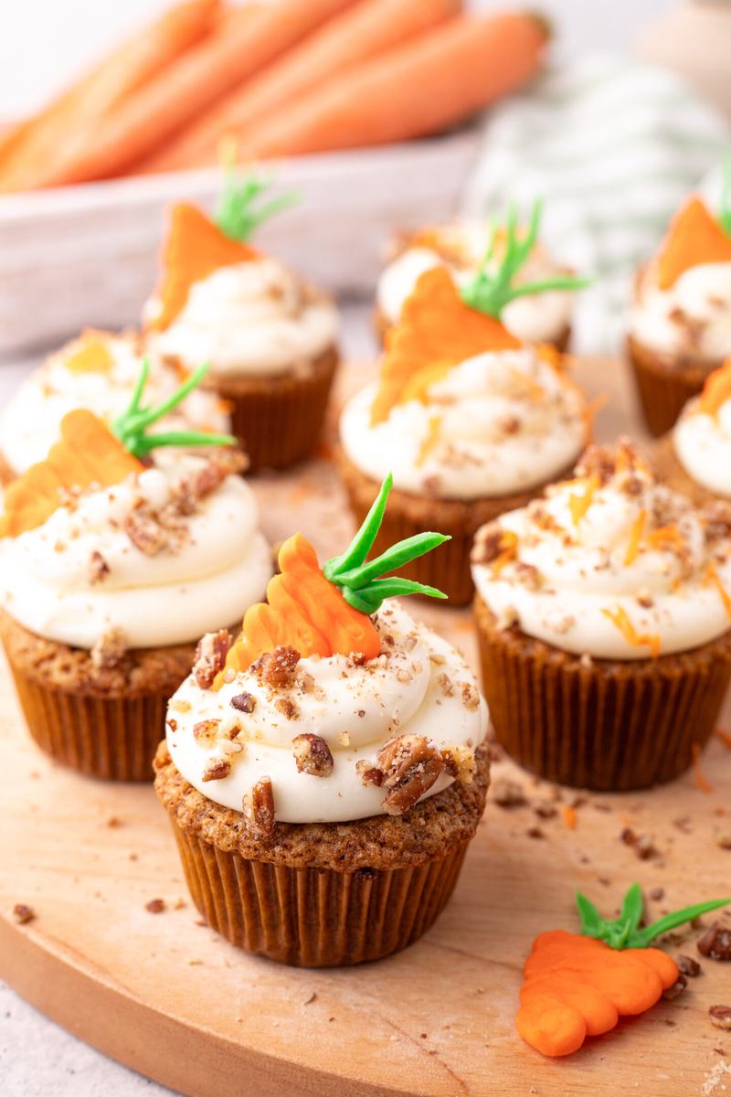 Homemade carrot cake cupcakes with a moist crumb, sweet carrot bits, and light cream cheese frosting