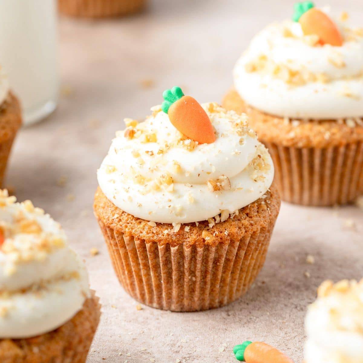 Brown butter carrot cupcake topped with silky cream cheese frosting and a sprinkle of sea salt