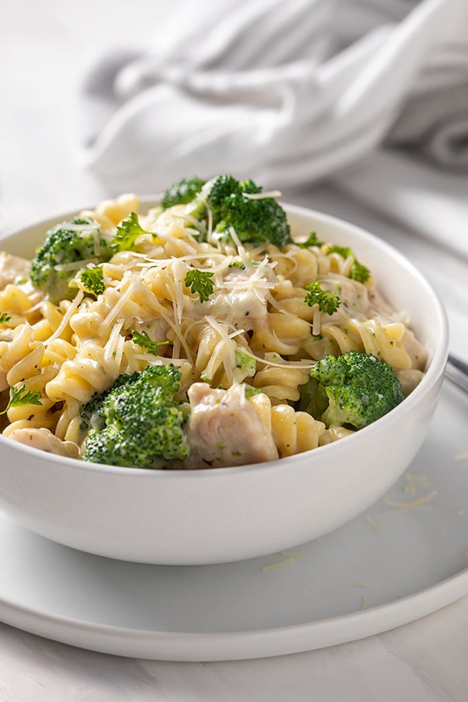 Chicken alfredo with broccoli, tender chicken strips, silky parmesan cream sauce, and fettuccine.