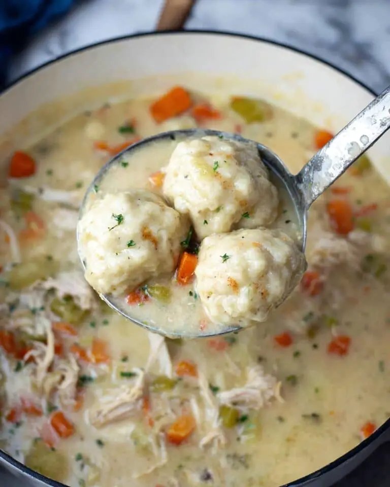 Classic creamy chicken pot pie soup with tender chicken, carrots, peas, potatoes, and a flaky pastry crust topping