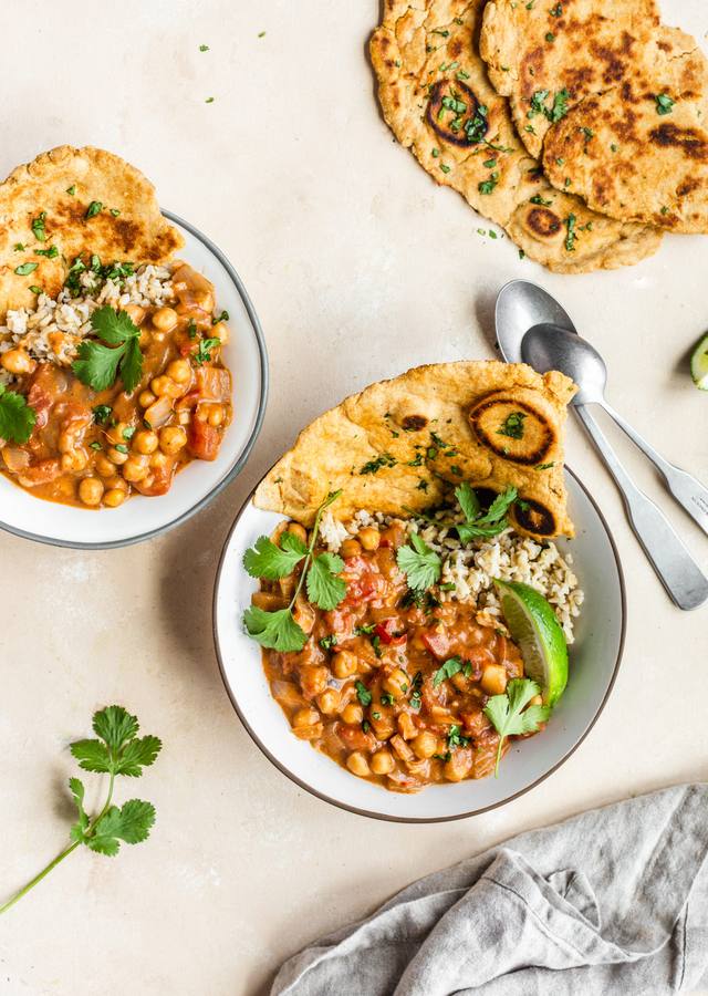 Silky coconut chickpea curry with a golden sauce, fresh cilantro, and lime, served over fluffy basmati rice.
