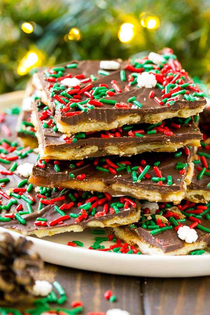 Crispy saltine toffee bark topped with melted chocolate and festive sprinkles