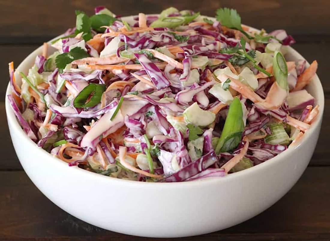 Traditional sweet creamy coleslaw featuring crisp cabbage, velvety dressing, and irresistible cool crunch.