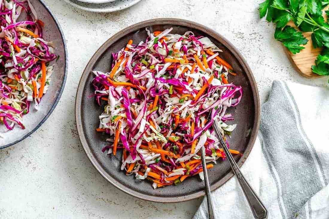 Honey‑ginger vinaigrette tossed with crisp cabbage, sweet tang, and fresh crunch