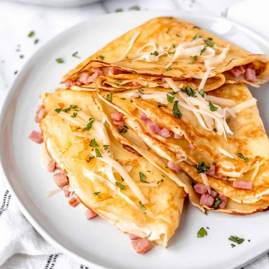 Thin crepes filled with ham, cheese, spinach, topped with melted mozzarella