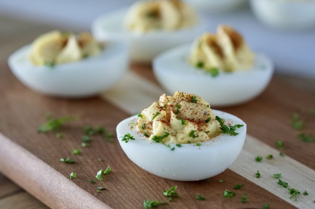 Rustic deviled eggs, creamy yolk, paprika sprinkle, dill fronds, rustic presentation