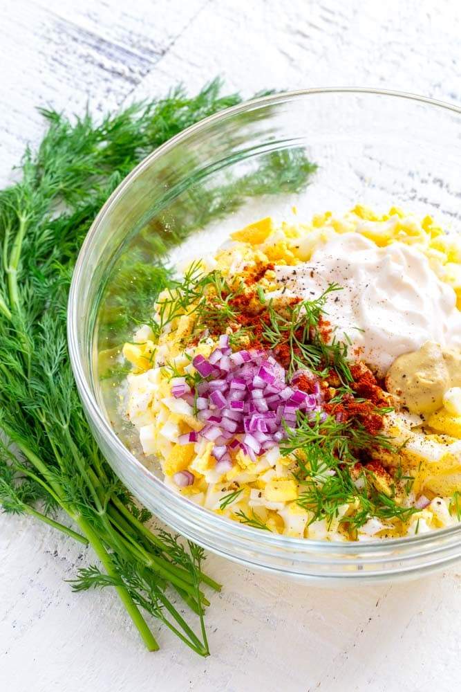 Classic creamy egg salad with chopped hard-boiled eggs, smooth mayo, parsley, and a sprinkle of paprika