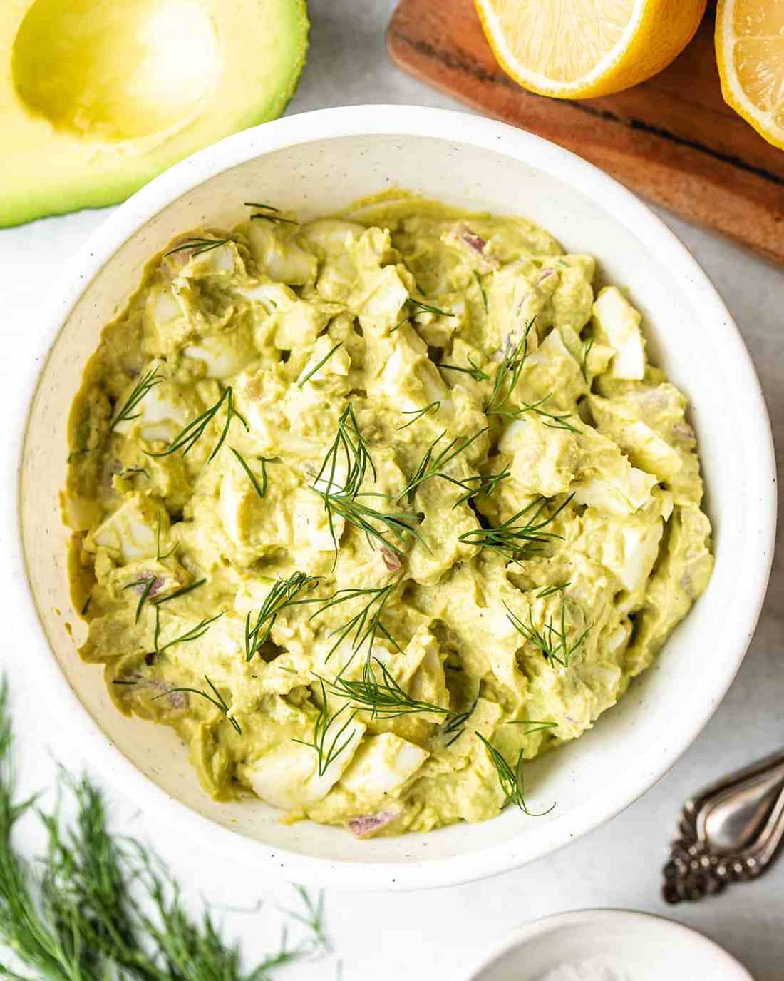 Fresh avocado egg salad with chopped hard‑boiled eggs, silky mayo, lime zest, and herbs, perfect for sandwich spreads