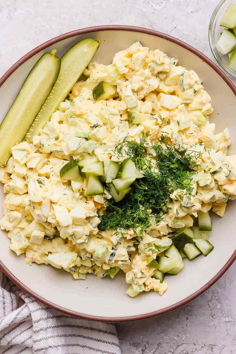 Dill pickle egg salad with chopped hard-boiled eggs, tangy pickles, creamy mayo, fresh dill, perfect for sandwiches