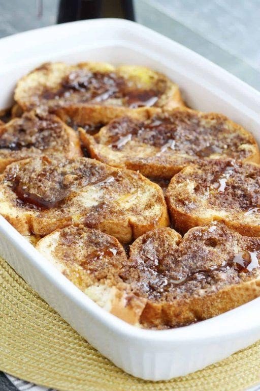 Blueberry lemon overnight French toast casserole with golden custardy bread cubes, fresh blueberries, and a citrusy glaze