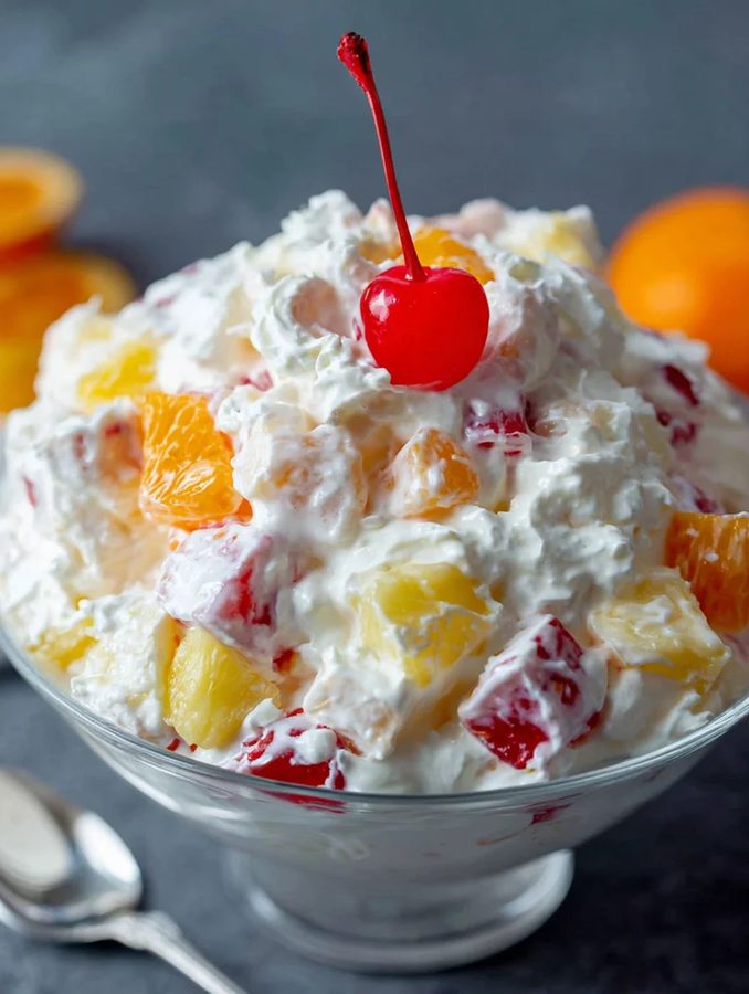Colorful garden-fresh fruit salad with mango, grapes, berries, and citrus zest