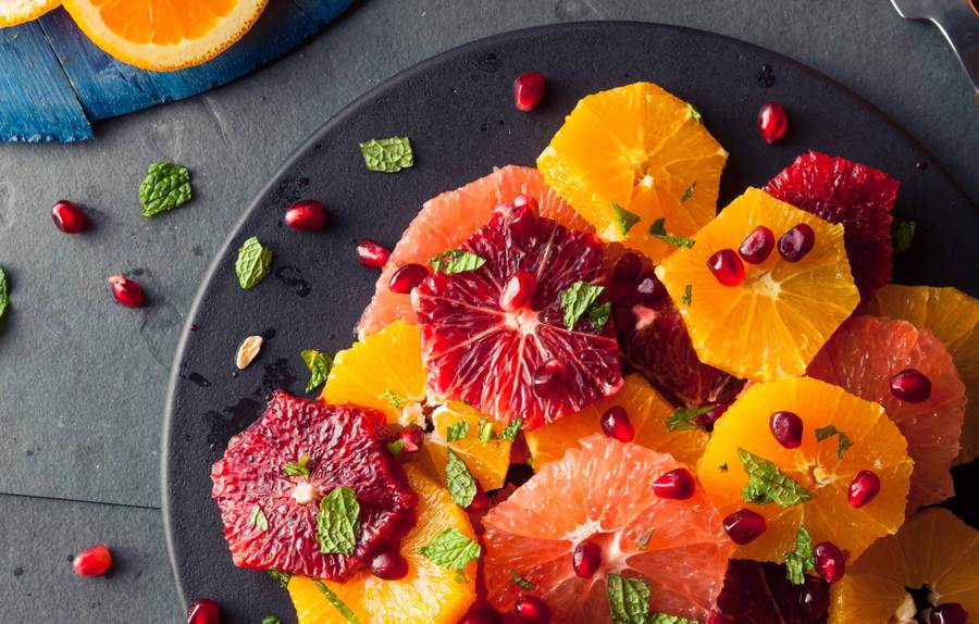 Fresh berry fruit salad with lemon zest, honey, and a hint of fresh basil