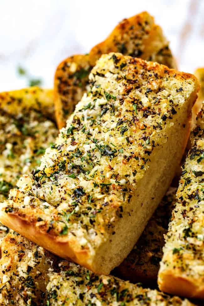 Ciabatta sticks brushed with garlic butter, golden crust, and fragrant herbs