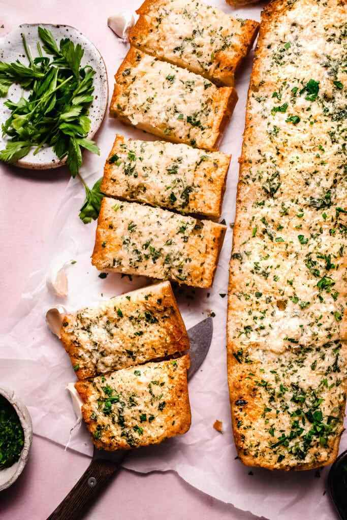 Air fryer garlic bread with golden crust, crispy edges, fragrant garlic butter, and fresh herbs