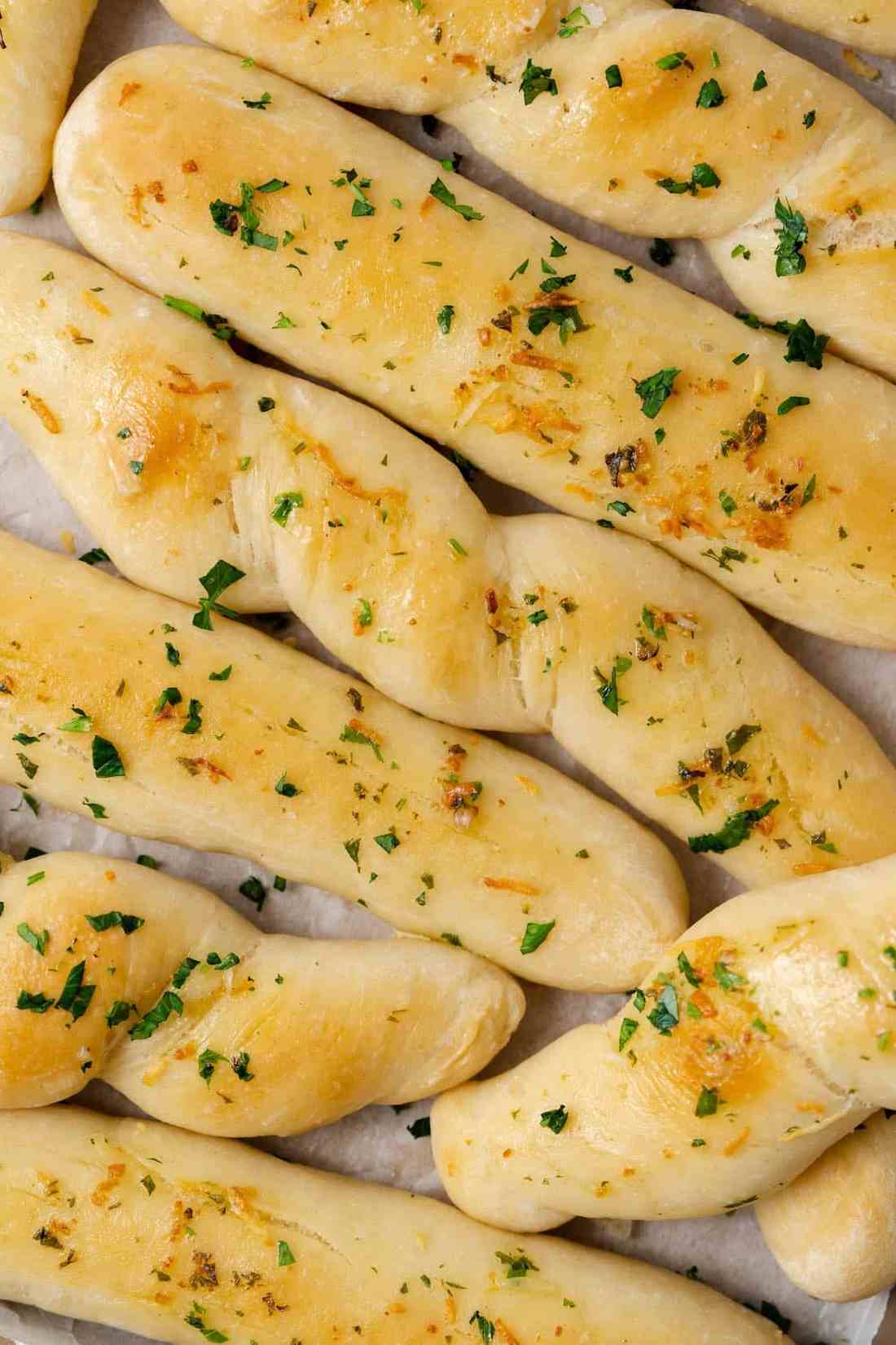 Garlic bread sticks with crispy herb crust, buttery garlic, and melted cheese