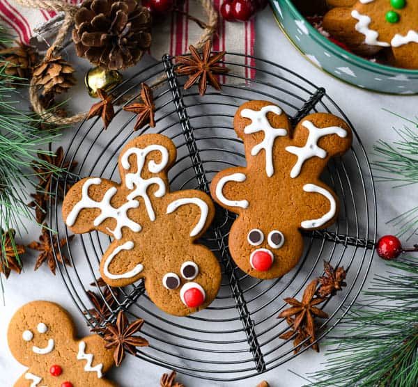 Cute gingerbread reindeer with white royal icing antlers and festive accents