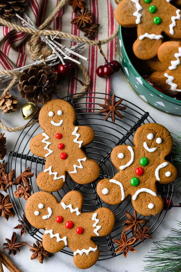 Gingerbread men and women adorned with colorful candy button decorations