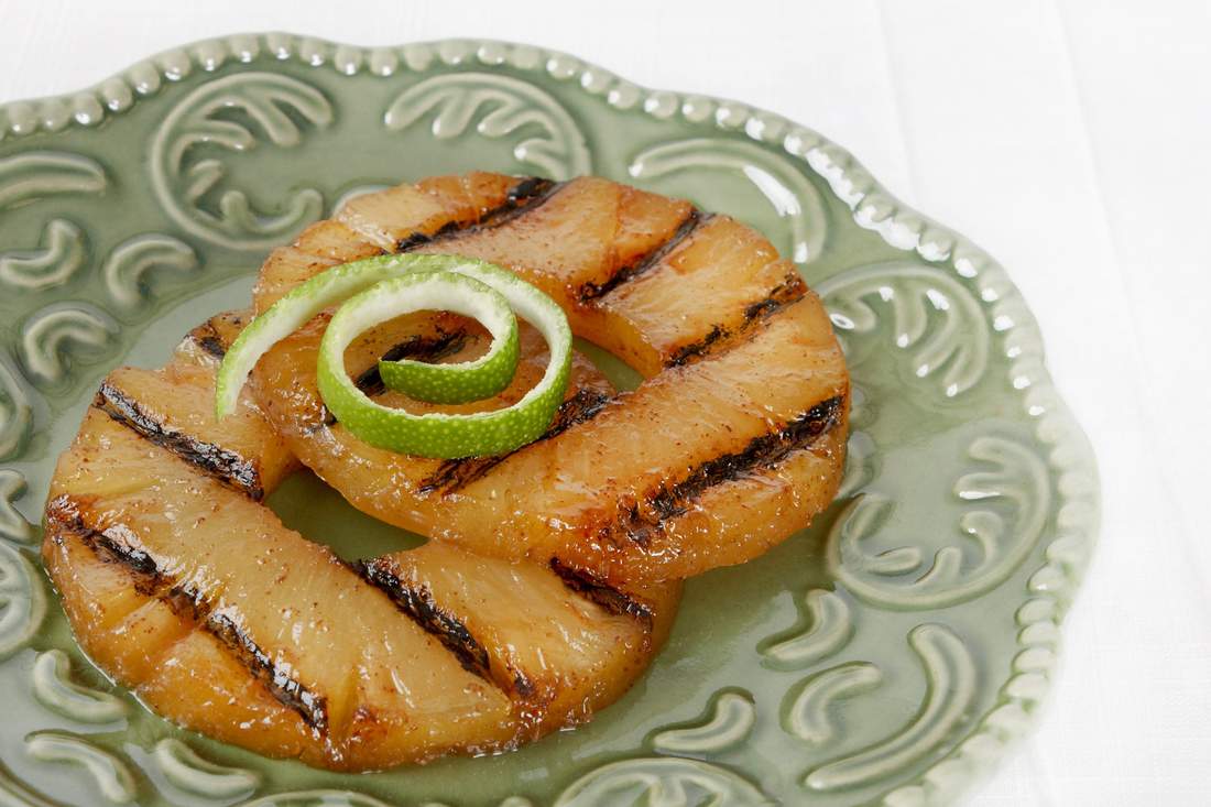 Grilled pineapple rings, crisp broccoli florets, tangy dressing, toasted nuts, sweet dried fruit, melted cheese