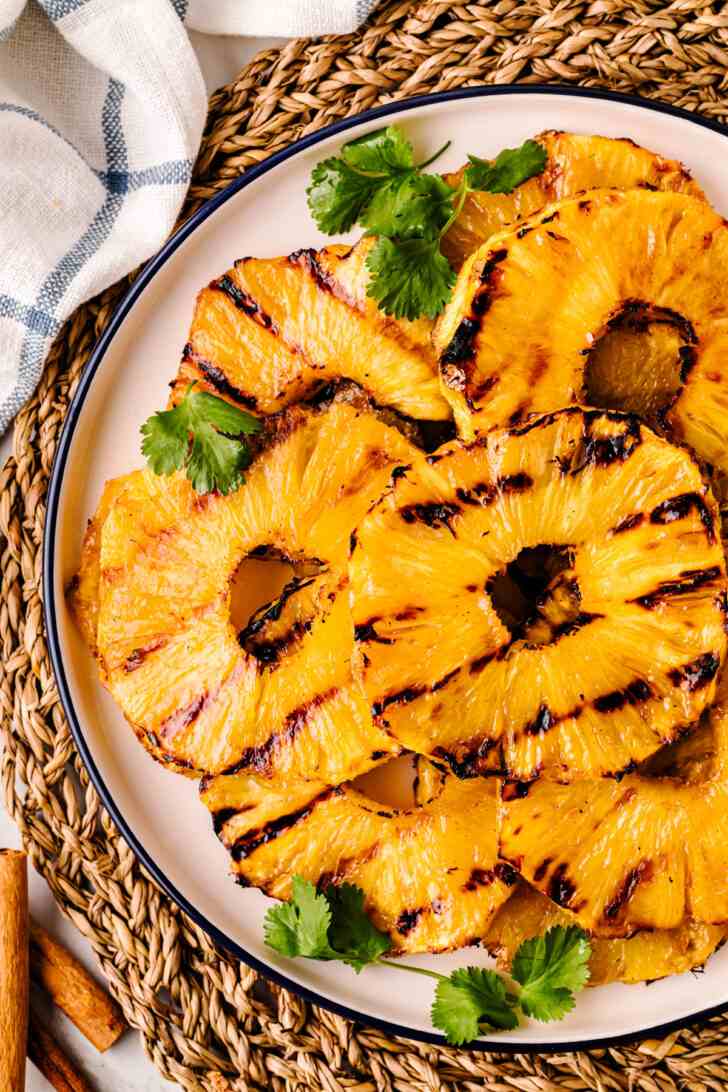Grilled pineapple rings, crisp broccoli florets, tangy dressing, toasted nuts, sweet dried fruit, melted cheese