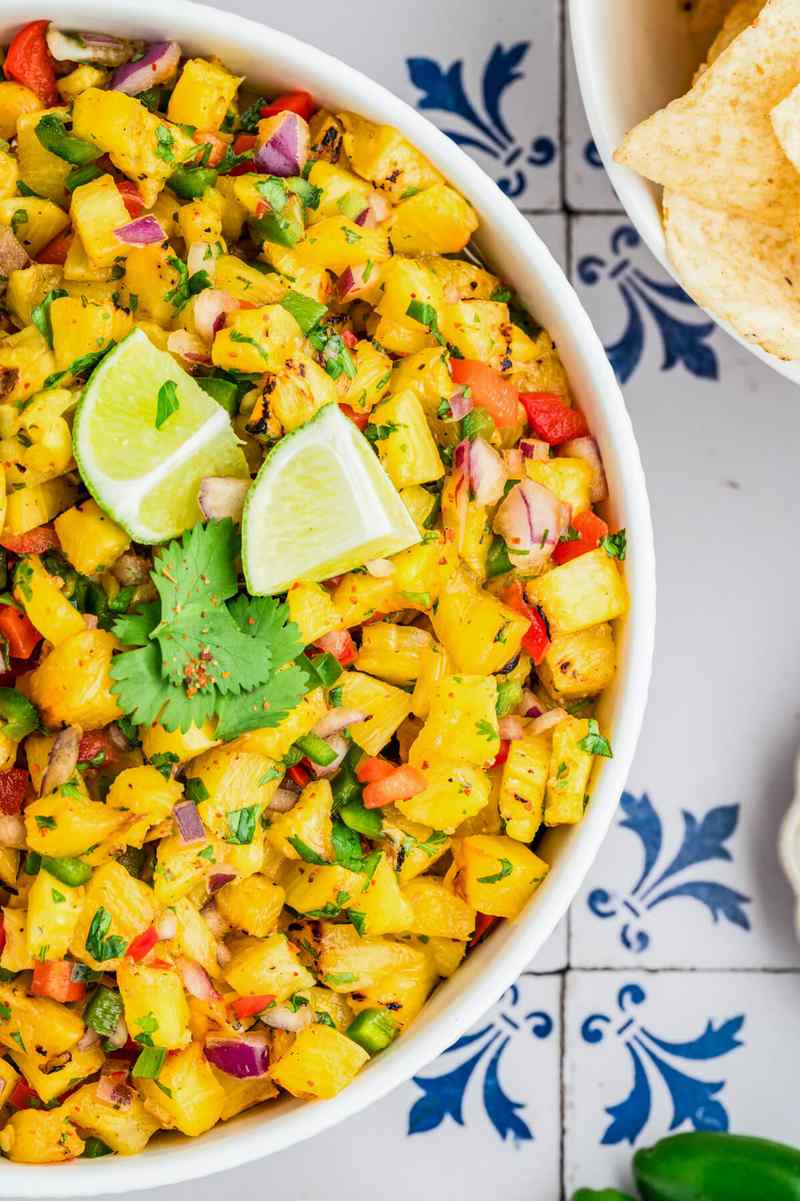Grilled pineapple salsa with crisp broccoli, tangy dressing, toasted nuts, dried fruit, and cheese.