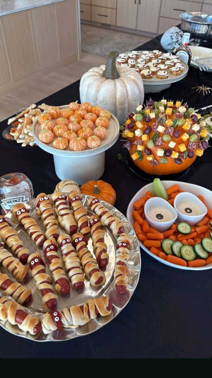 A detailed spread of Halloween party foods with a focus on visual appeal.