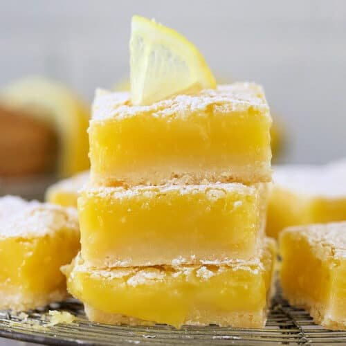 Classic lemon bars with golden shortbread crust, bright lemon curd, and powdered sugar dusting