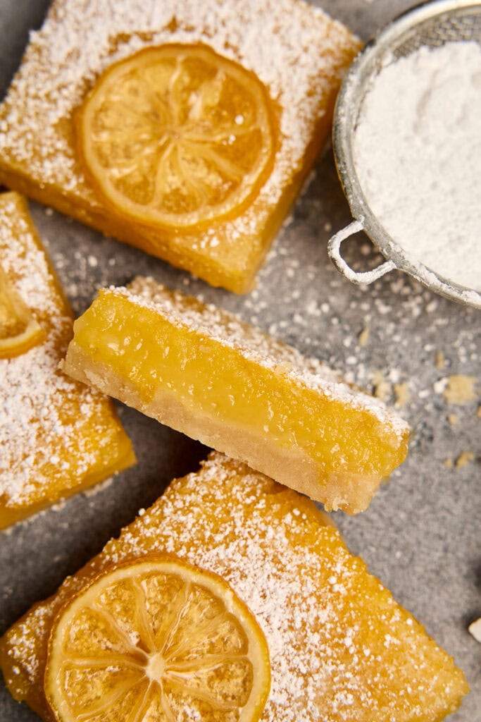 Classic lemon bars with golden shortbread crust, bright lemon curd, and powdered sugar dusting