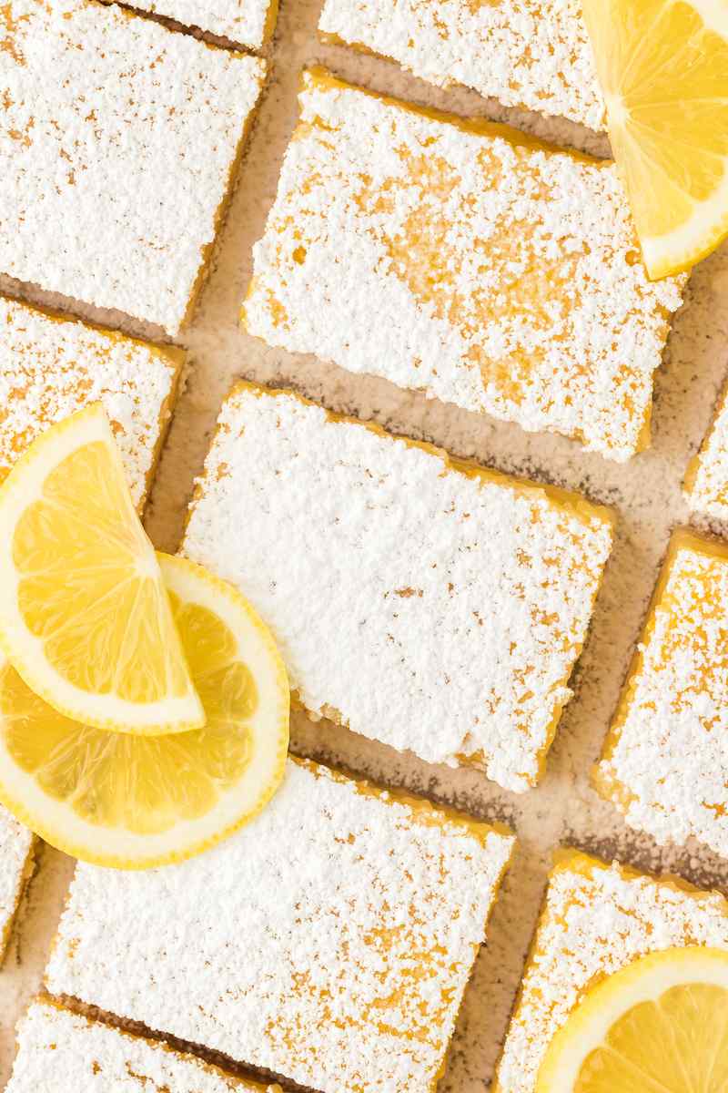 Golden shortbread crust topped with bright lemon curd, dusted with powdered sugar