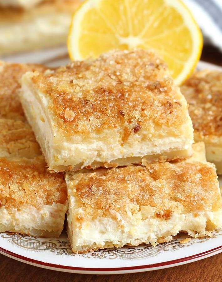 Classic lemon bars, crisp shortbread crust, bright lemon curd, generous powdered sugar dusting