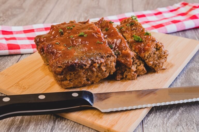Brown sugar glazed meatloaf with caramelized crust, juicy beef, sweet glaze, comforting family dinner