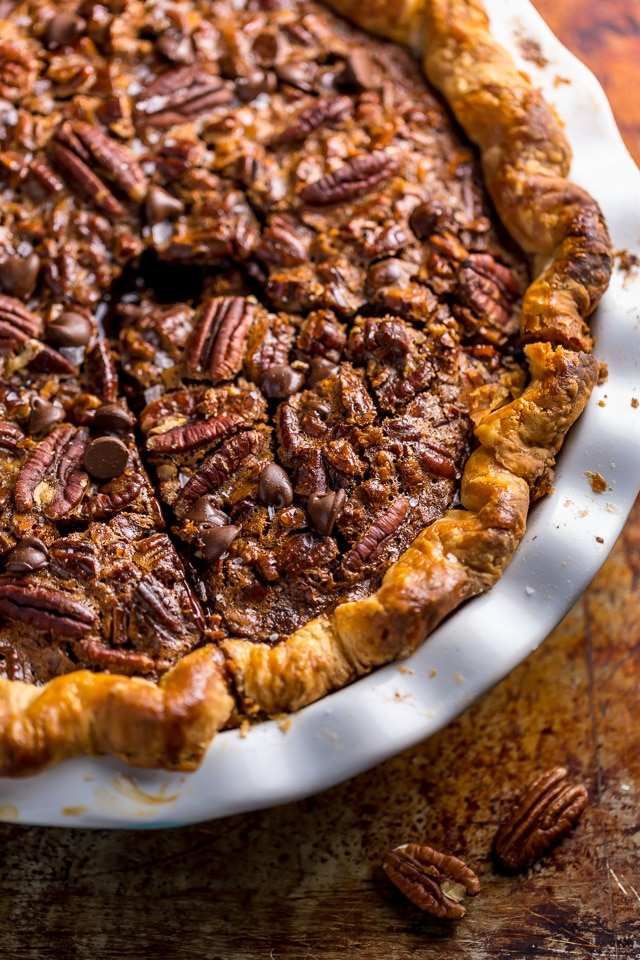 Golden classic pecan pie infused with dark rum and brown butter sauce