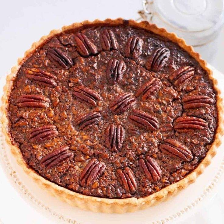 Traditional golden classic pecan pie slice with rich caramel filling and toasted pecans on crust