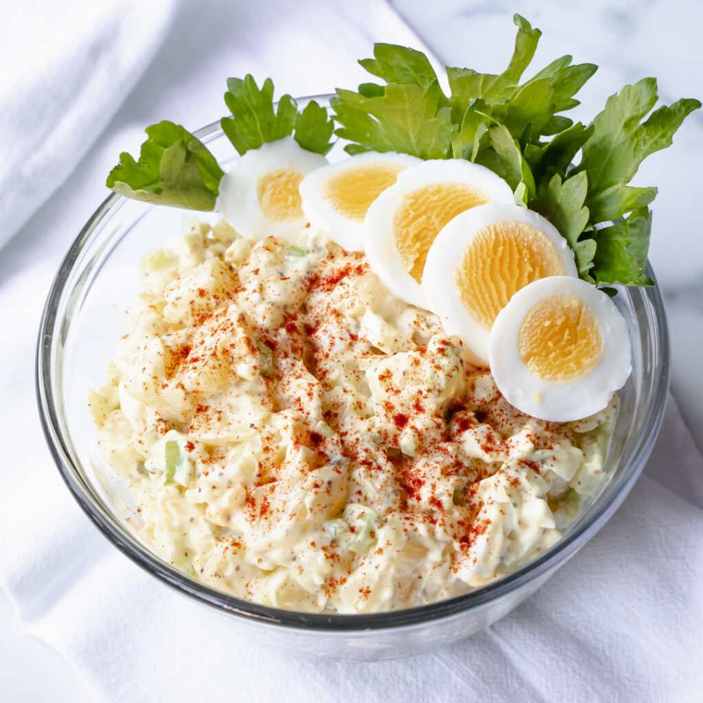 Southern‑charm creamy potato salad with buttery potatoes, tangy mayo, fresh parsley, and crunchy celery