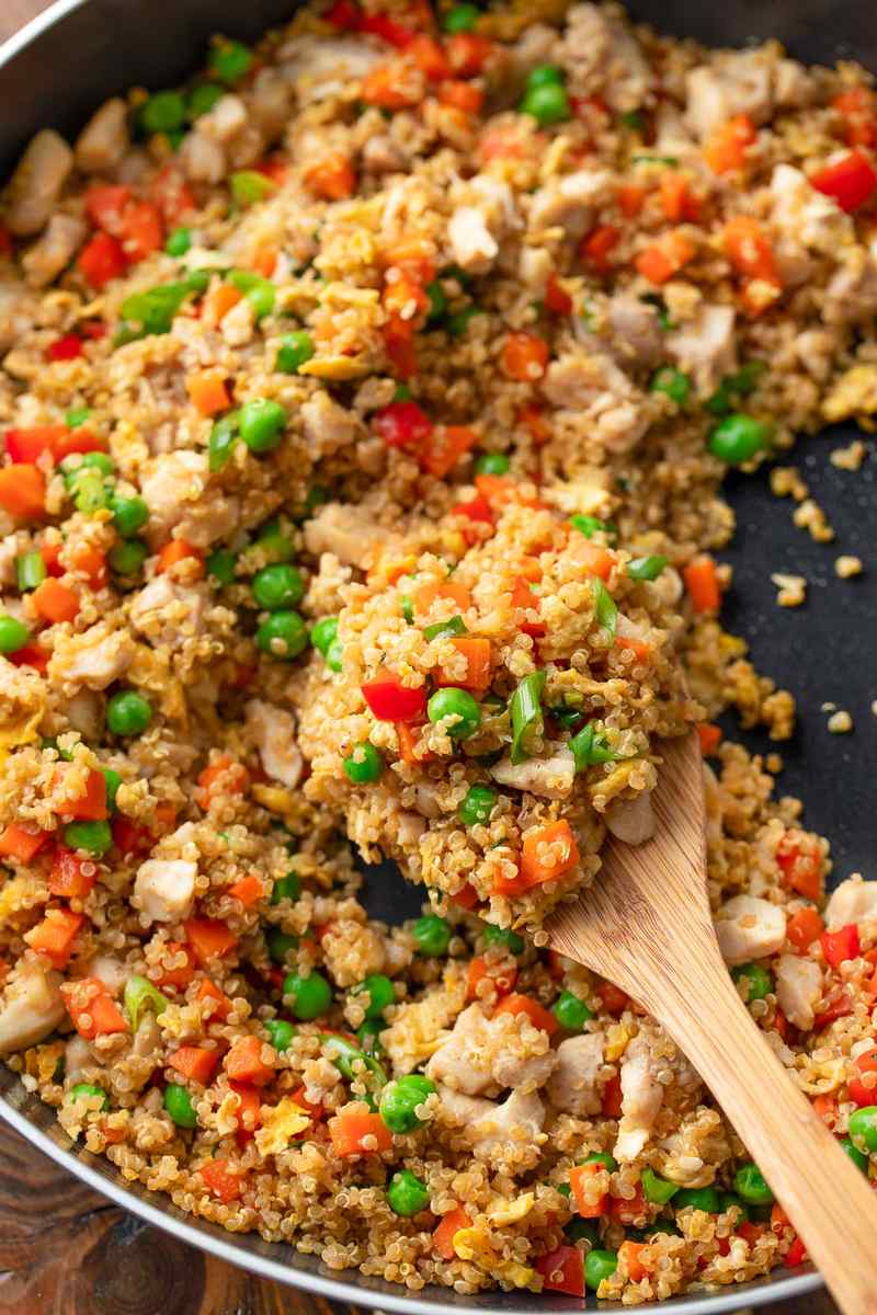 Crispy chicken quinoa fried rice with fluffy grains, crunchy veggies, and soy glaze