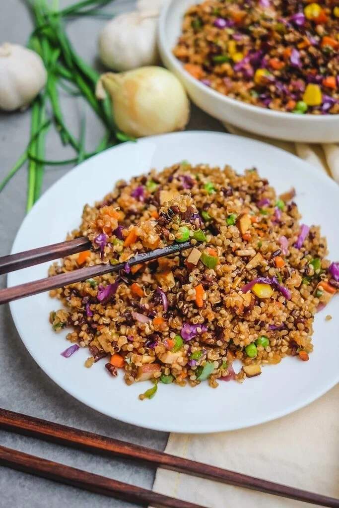 Veggie quinoa fried rice with fluffy quinoa, bright bell peppers, broccoli, and a savory soy glaze