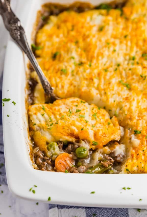 Classic shepherd's pie, bacon‑crisped mashed topping, savory lamb filling, bubbling cheese, warm casserole dish