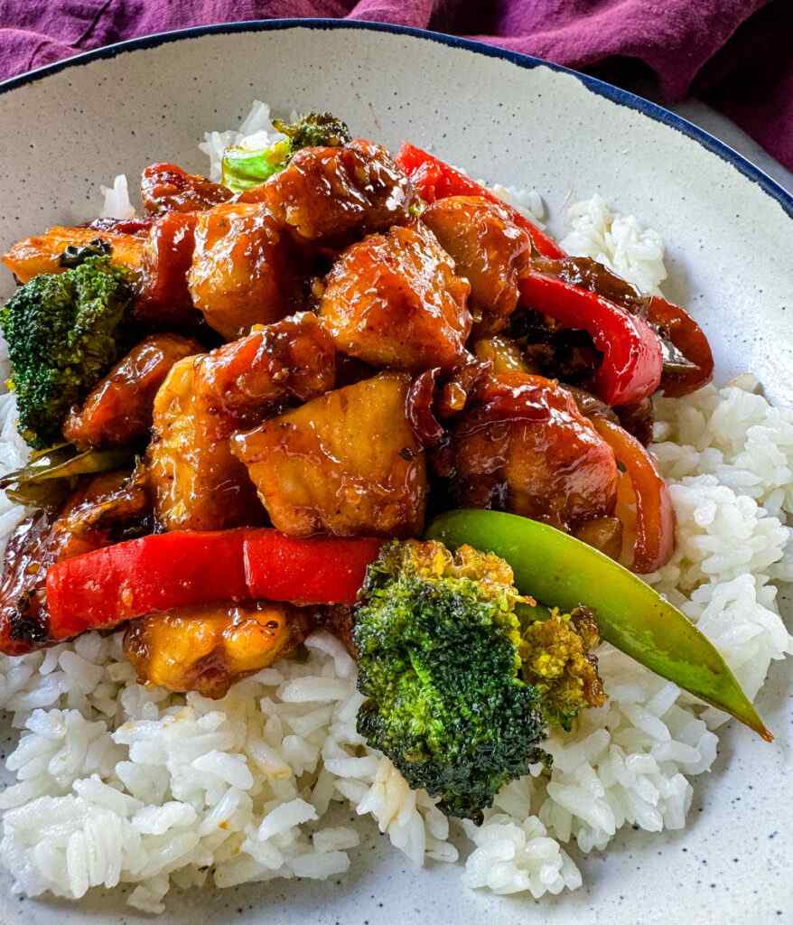 Lean orange‑glazed chicken stir‑fry with snap peas and a bright citrus glaze