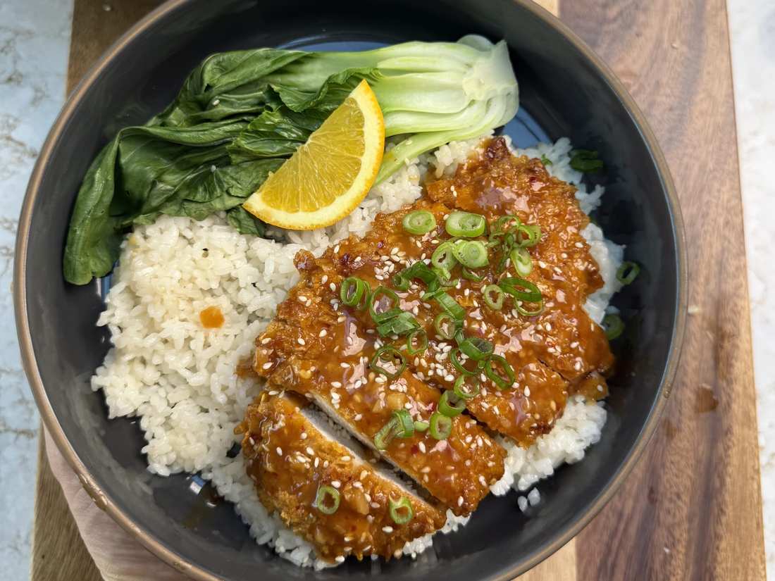 Orange‑glazed skinny chicken served over sautéed spinach with crumbled feta and fresh orange segments