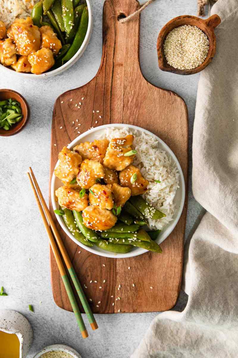 Orange‑glazed skinny chicken served over cauliflower rice from the air fryer with fresh orange zest