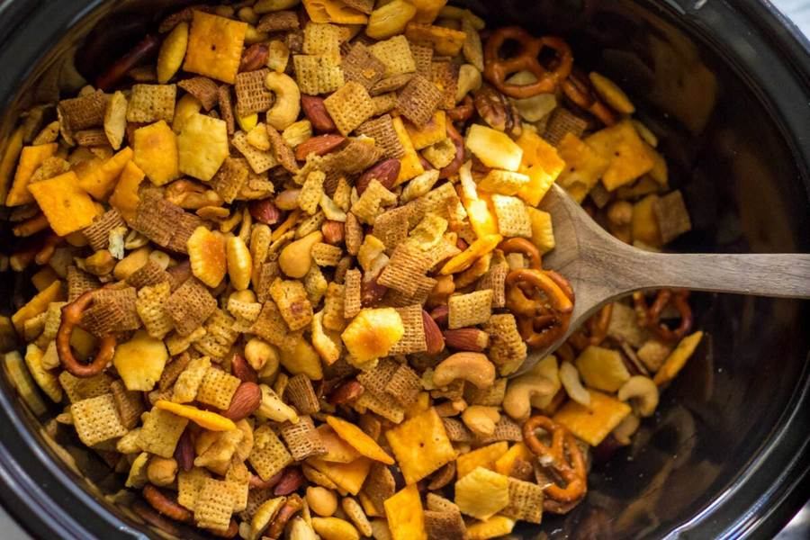 Crunchy classic Chex mix with pretzels, walnuts, butter, and savory seasoning