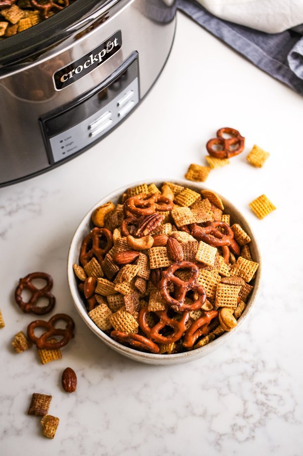 Pumpkin spice chex mix with crunchy Chex cereal, pretzels, nuts, aromatic spice blend, and a golden glaze